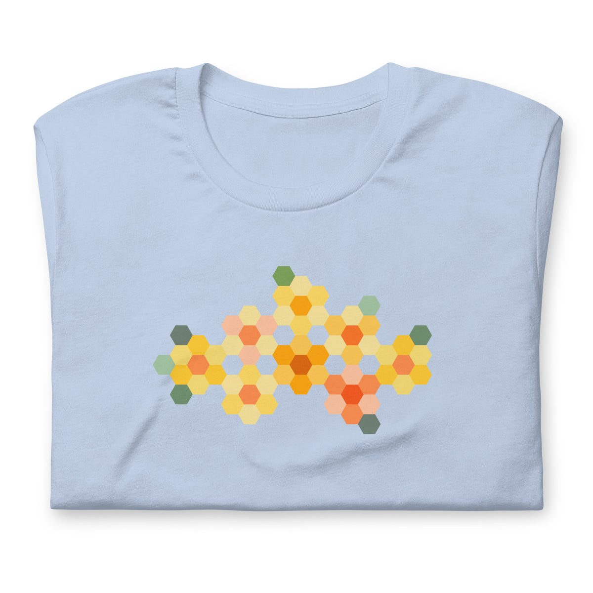 Yellow GeoFlora hexagon flowers in golden yellow, orange, coral and sage on a t-shirt in light blue, folded close-up of the design – Kate Spain design for Pat Sloan