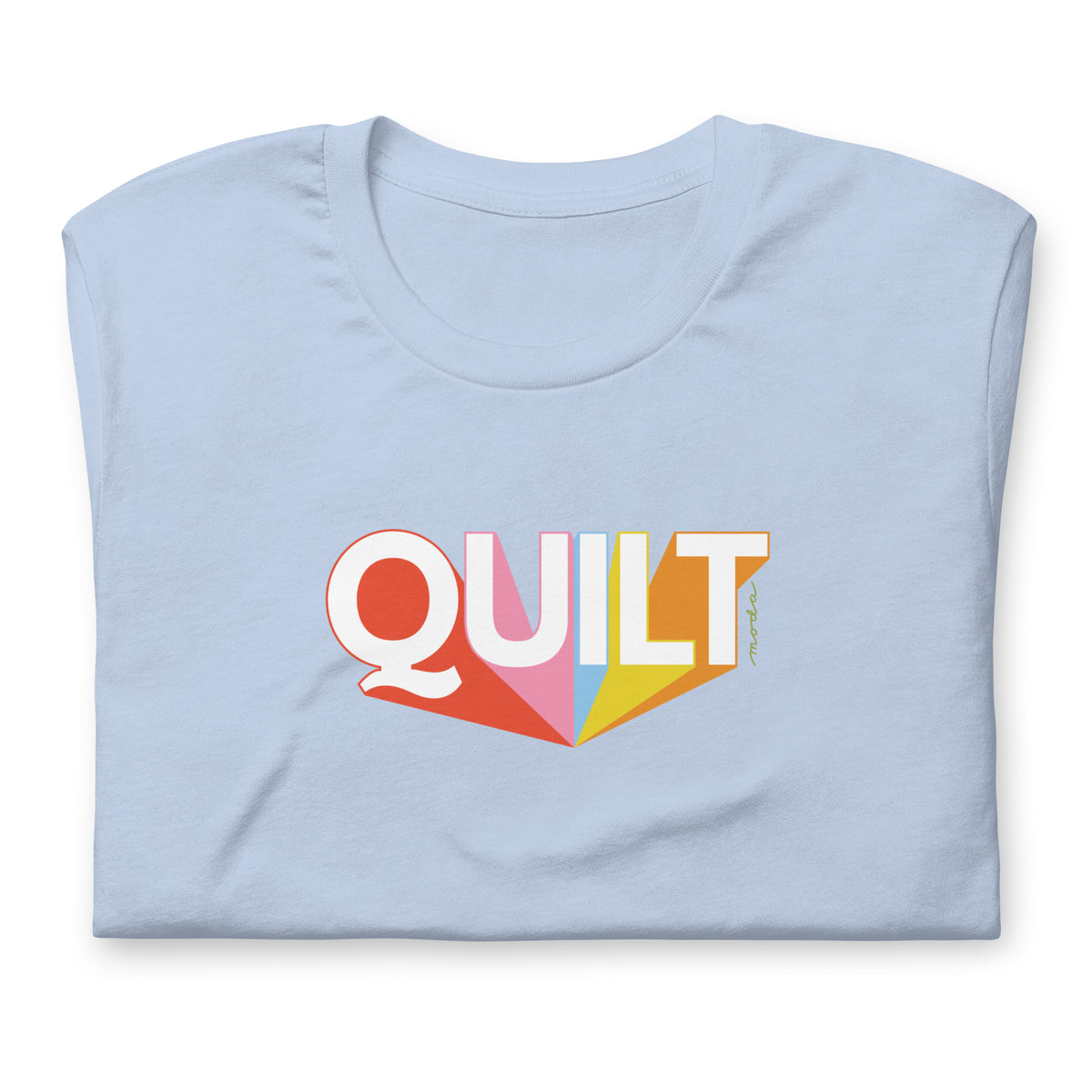 Moda QUILT logo with orange, pink, blue and yellow rays on a staple t-shirt in light blue, folded close-up of the design – Kate Spain design