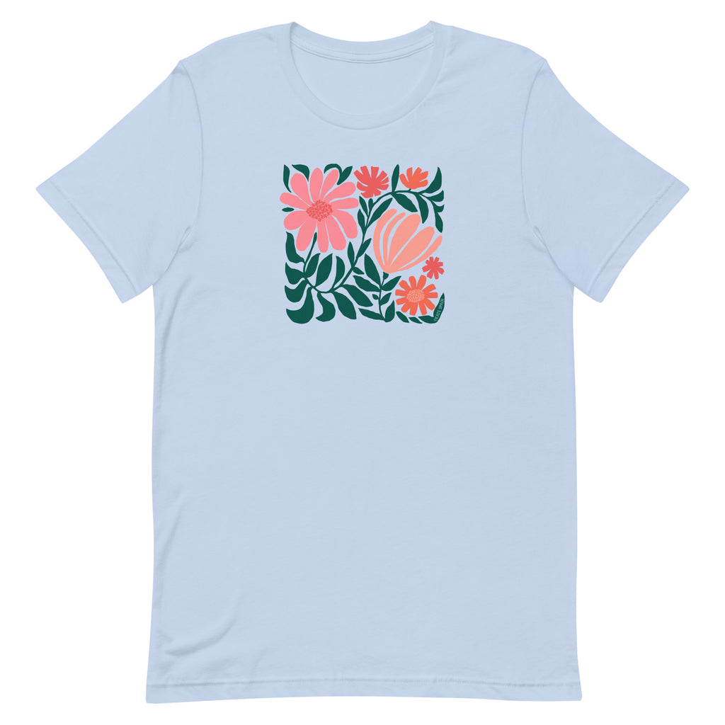 Botanica modern floral design with pink and coral blooms on a t-shirt in light blue, front view – Kate Spain design