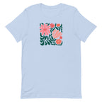 Botanica modern floral design with pink and coral blooms on a t-shirt in light blue, front view – Kate Spain design