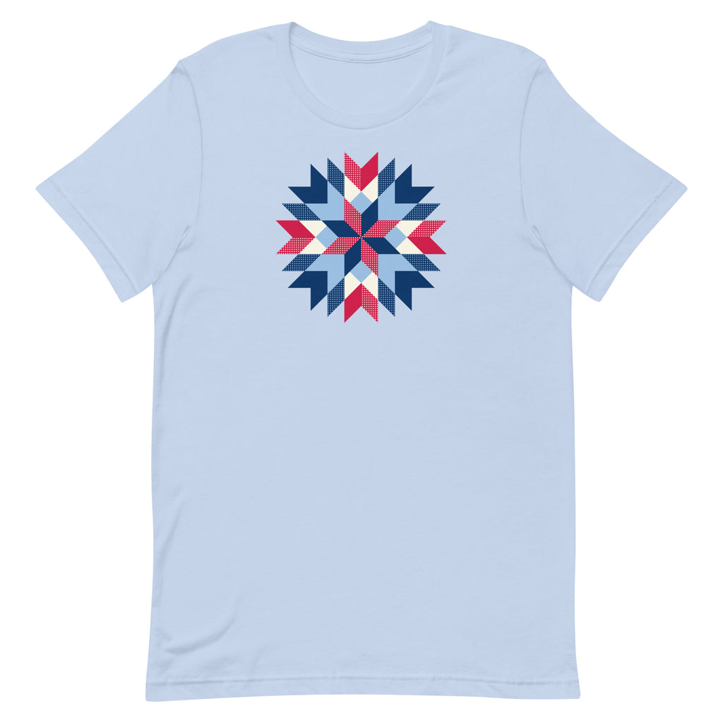 Barn Star quilt block in red, white and blue on a staple t-shirt in baby blue, front view – Kate Spain design for Pat Sloan