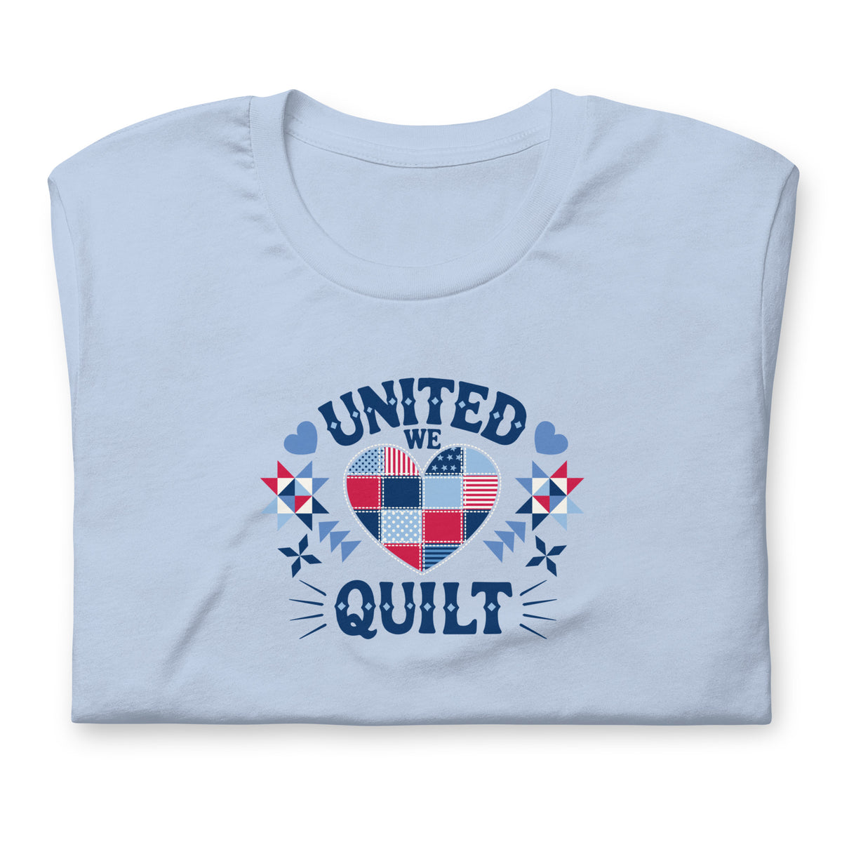 United We Quilt patchwork heart with quilt stars on a staple t-shirt in light blue, folded close-up of the design – Kate Spain design for Pat Sloan