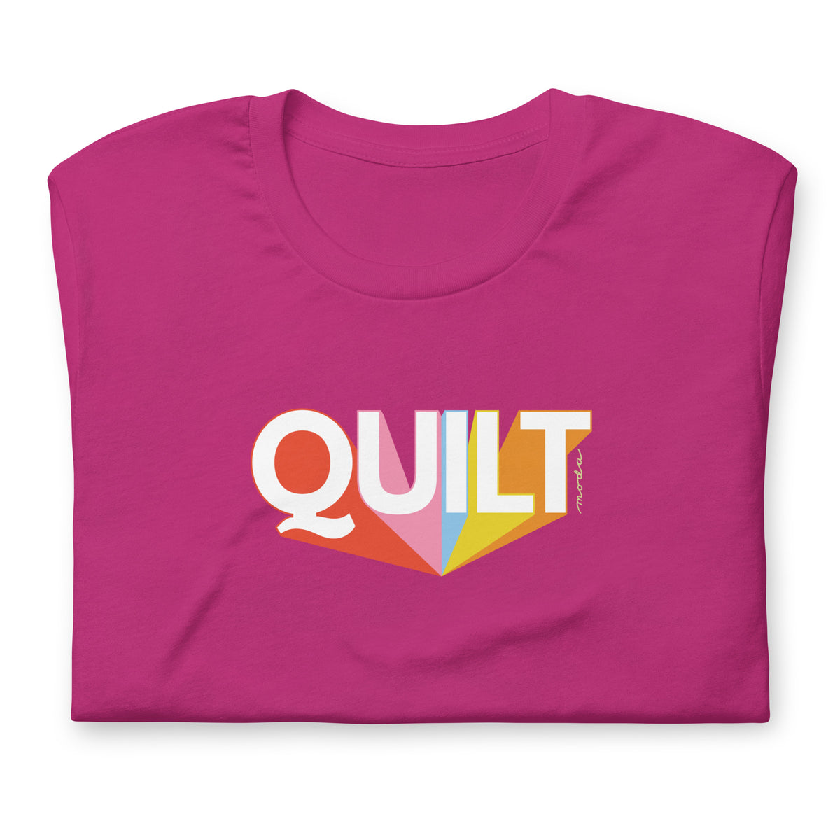 Moda QUILT logo with orange, pink, blue and yellow rays on a staple t-shirt in berry, folded close-up of the design – Kate Spain design