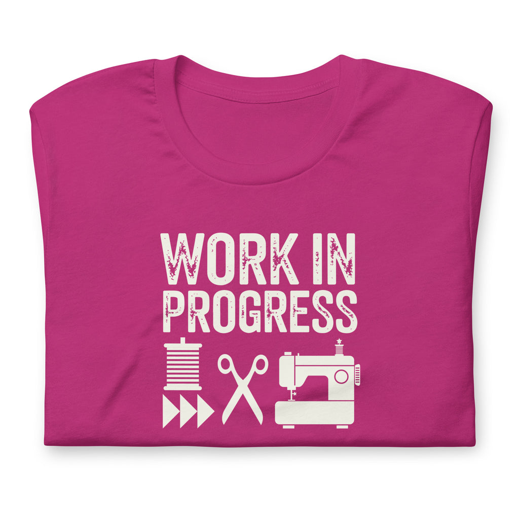 Work in Progress Mod distressed lettering with thread, scissors and sewing machine on a t-shirt in berry, folded close-up of the design – Kate Spain design for Pat Sloan