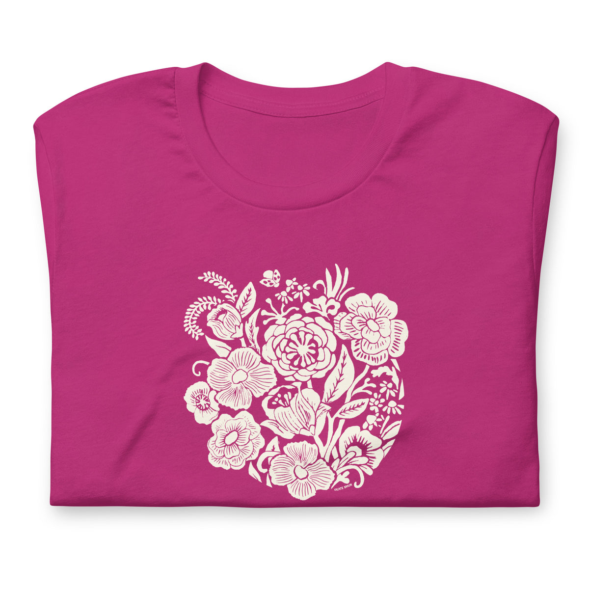 Meadowsweet woodblock-style bouquet of wildflowers on a t-shirt in berry, folded close-up of the design – Kate Spain design