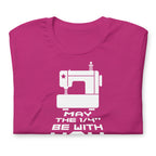 May the ¼" Be With You white sewing machine graphic on a staple t-shirt in berry, folded close-up of the design – Kate Spain design for Pat Sloan