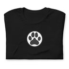Law of the Paw® dog paw print on a t-shirt in black, folded close-up of the design – Kate Spain design