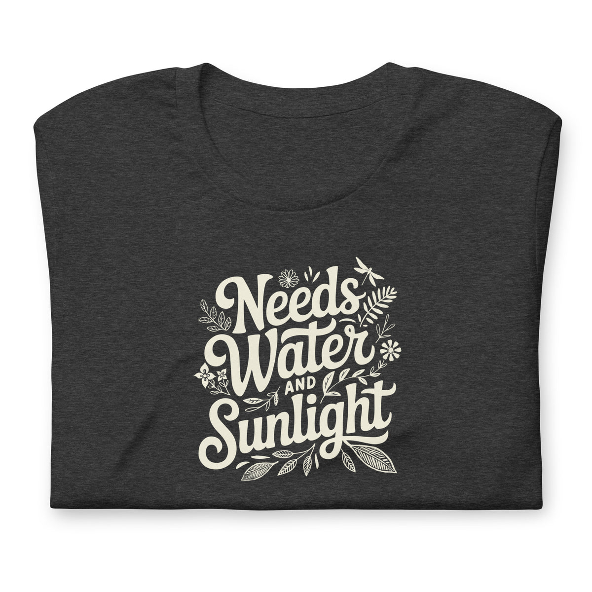 Needs Water + Sunlight hand lettering with leaf and sun accents on a t-shirt in dark grey heather, folded close-up of the design – Kate Spain design
