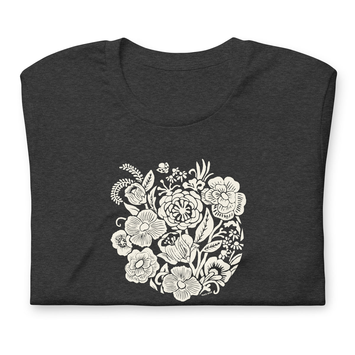 Meadowsweet woodblock-style bouquet of wildflowers on a t-shirt in dark grey heather, folded close-up of the design – Kate Spain design