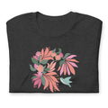 Hummingbird among coral tropical flowers on a t-shirt in dark grey heather, folded close-up of the design – Kate Spain design