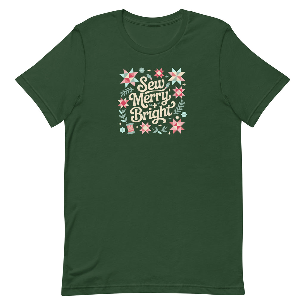 Sew Merry + Bright lettering with quilt stars and holly on a staple t-shirt in forest green, front view – Kate Spain design for Pat Sloan