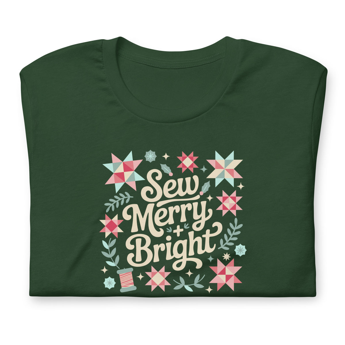Sew Merry + Bright lettering with quilt stars and holly on a staple t-shirt in forest green, folded close-up of the design – Kate Spain design for Pat Sloan