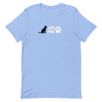 Law of the Paw® logo with seated dog and paw print on a t-shirt in heather Carolina blue, front view – Kate Spain design