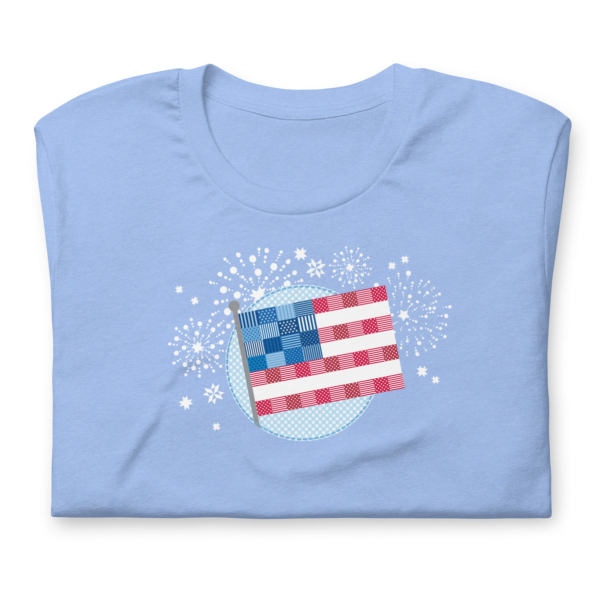 Patchwork Flag quilt-style flag with fireworks on a staple t-shirt in heather Carolina blue, folded close-up of the design – Kate Spain design for Pat Sloan