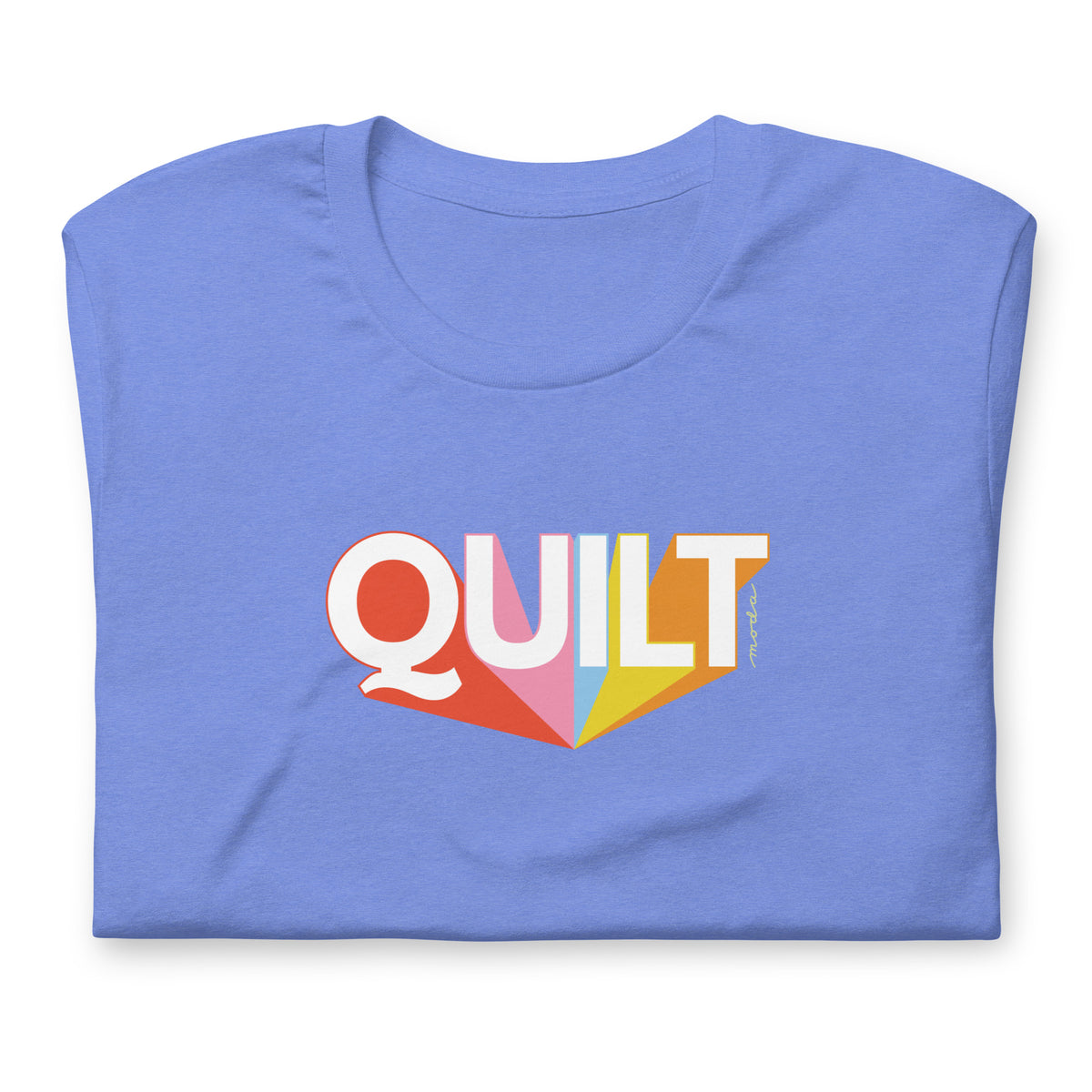Moda QUILT logo with orange, pink, blue and yellow rays on a staple t-shirt in heather Columbia blue, folded close-up of the design – Kate Spain design