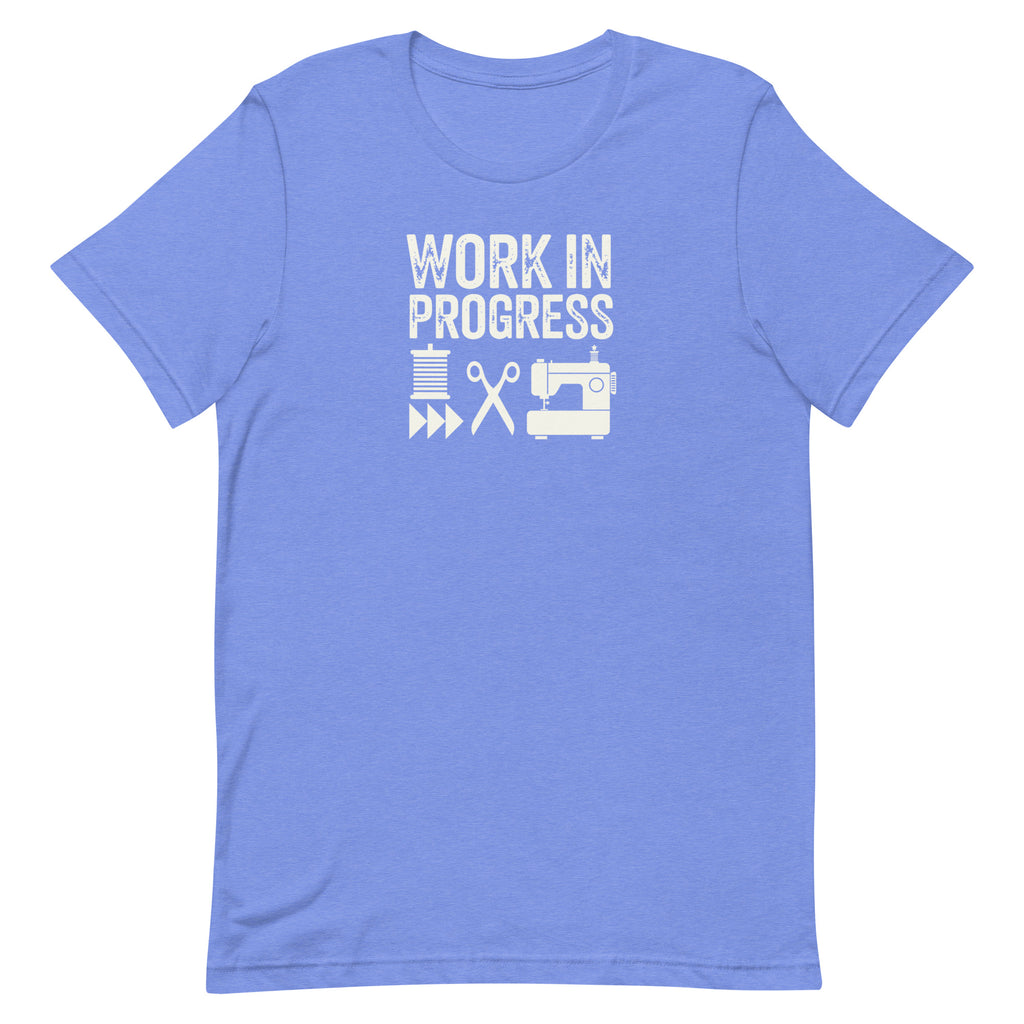 Work in Progress Mod distressed lettering with thread, scissors and sewing machine on a t-shirt in heather Columbia blue, front view – Kate Spain design for Pat Sloan
