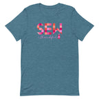 Sew Thankful patchwork lettering with a heart-topped thread spool on a t-shirt in heather deep teal, front view – Kate Spain design for Pat Sloan