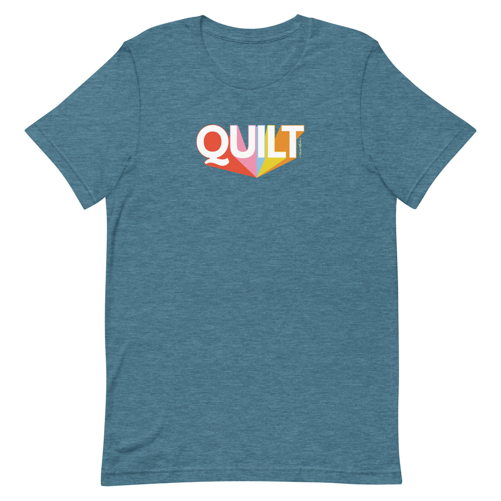Moda QUILT logo with orange, pink, blue and yellow rays on a staple t-shirt in heather deep teal, front view – Kate Spain design