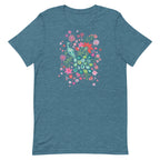 Peacock Flowers design, a peacock among coral, pink, mint and teal blooms on a t-shirt in heather deep teal, front view – Kate Spain design