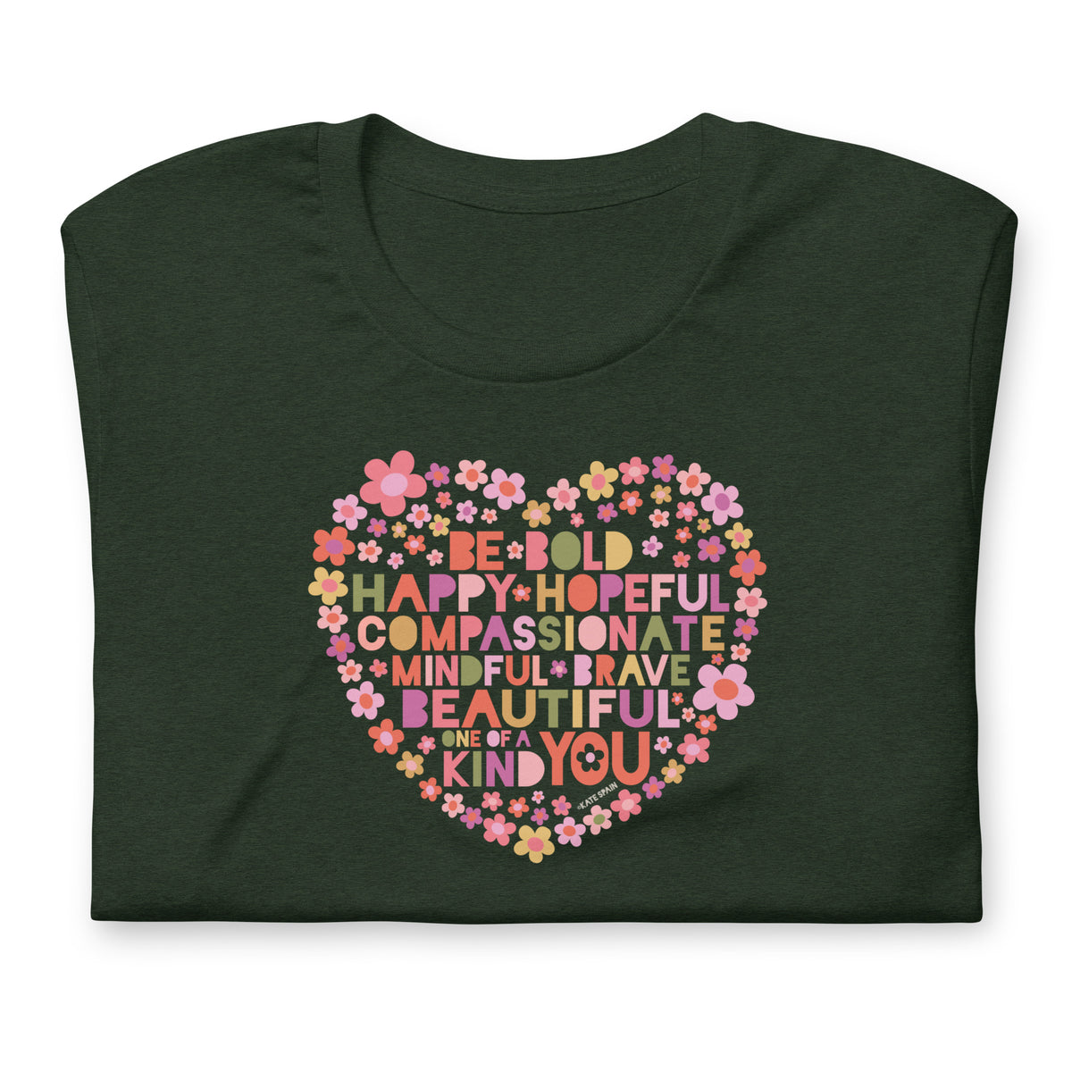 Be You floral heart of inspirational words on a staple t-shirt in heather emerald, folded close-up of the design – Kate Spain design