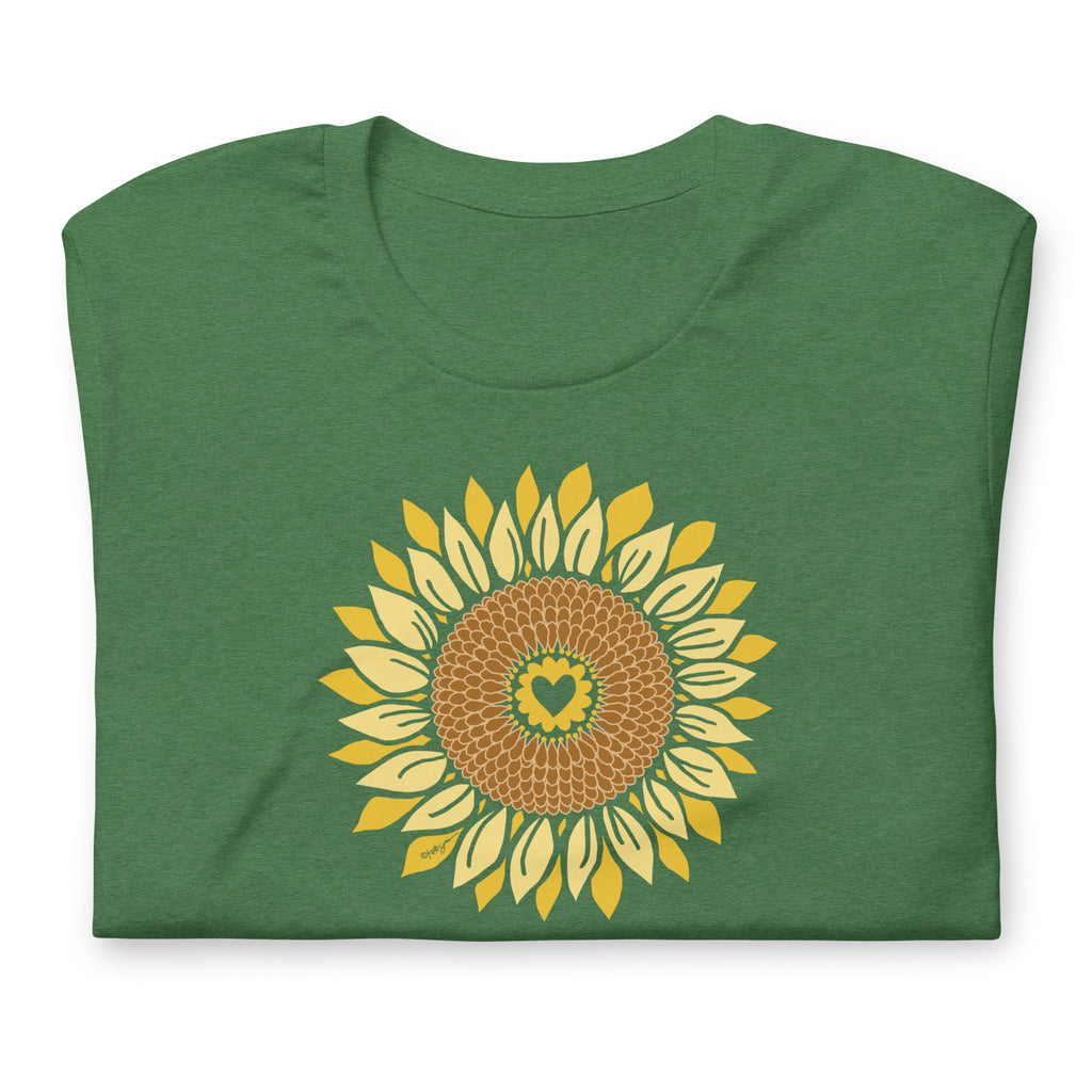 Golden sunflower with a heart center on a crewneck t-shirt in heather grass green, folded close-up of the design – Sunflowers in My Heart by Kate Spain