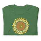 Golden sunflower with a heart center on a crewneck t-shirt in heather grass green, folded close-up of the design – Sunflowers in My Heart by Kate Spain