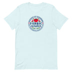 Fabric Curator Society of Stashers badge with a tomato pincushion on a t-shirt in heather ice blue, front view – Kate Spain design for Pat Sloan