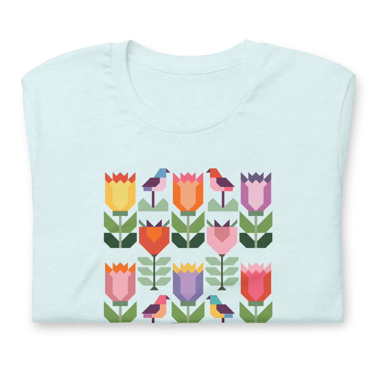 Birds + Blooms patchwork tulips and birds on a t-shirt in heather ice blue, folded close-up of the design – Kate Spain design for Pat Sloan