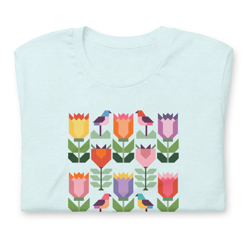 Birds + Blooms patchwork tulips and birds on a t-shirt in heather ice blue, folded close-up of the design – Kate Spain design for Pat Sloan