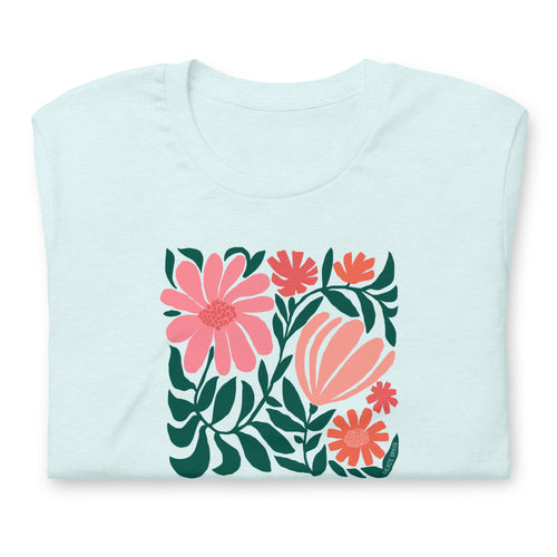 Botanica modern floral design with pink and coral blooms on a t-shirt in heather ice blue, folded close-up of the design – Kate Spain design