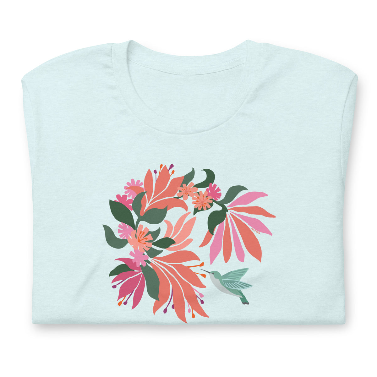 Hummingbird among coral tropical flowers on a t-shirt in heather ice blue, folded close-up of the design – Kate Spain design