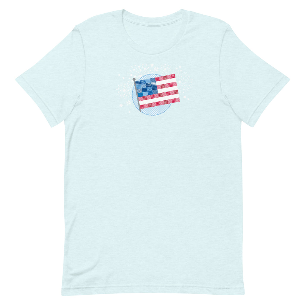 Patchwork Flag quilt-style flag with fireworks on a staple t-shirt in heather ice blue, front view – Kate Spain design for Pat Sloan