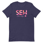 Sew Thankful patchwork lettering with a heart-topped thread spool on a t-shirt in heather navy, front view – Kate Spain design for Pat Sloan
