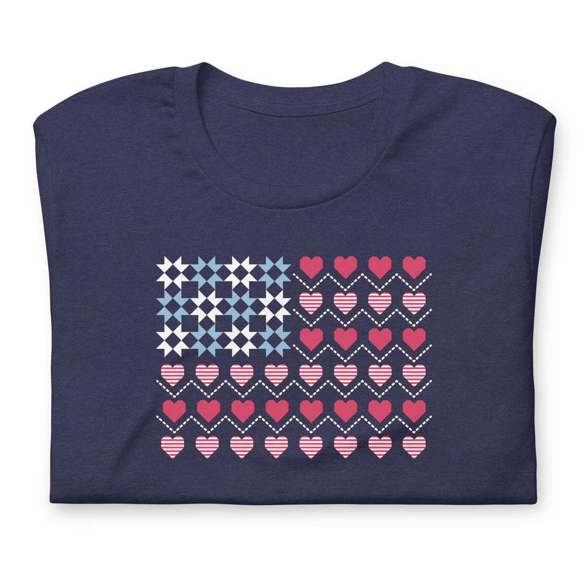 United We Quilt patchwork flag with quilt-block stars and heart stripes on a t-shirt in heather navy, folded close-up of the design – Kate Spain design for Pat Sloan