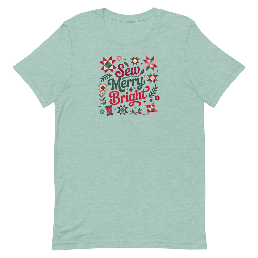 Sew Merry + Bright lettering with quilt stars and holly on a staple t-shirt in heather prism jade, front view – Kate Spain design for Pat Sloan