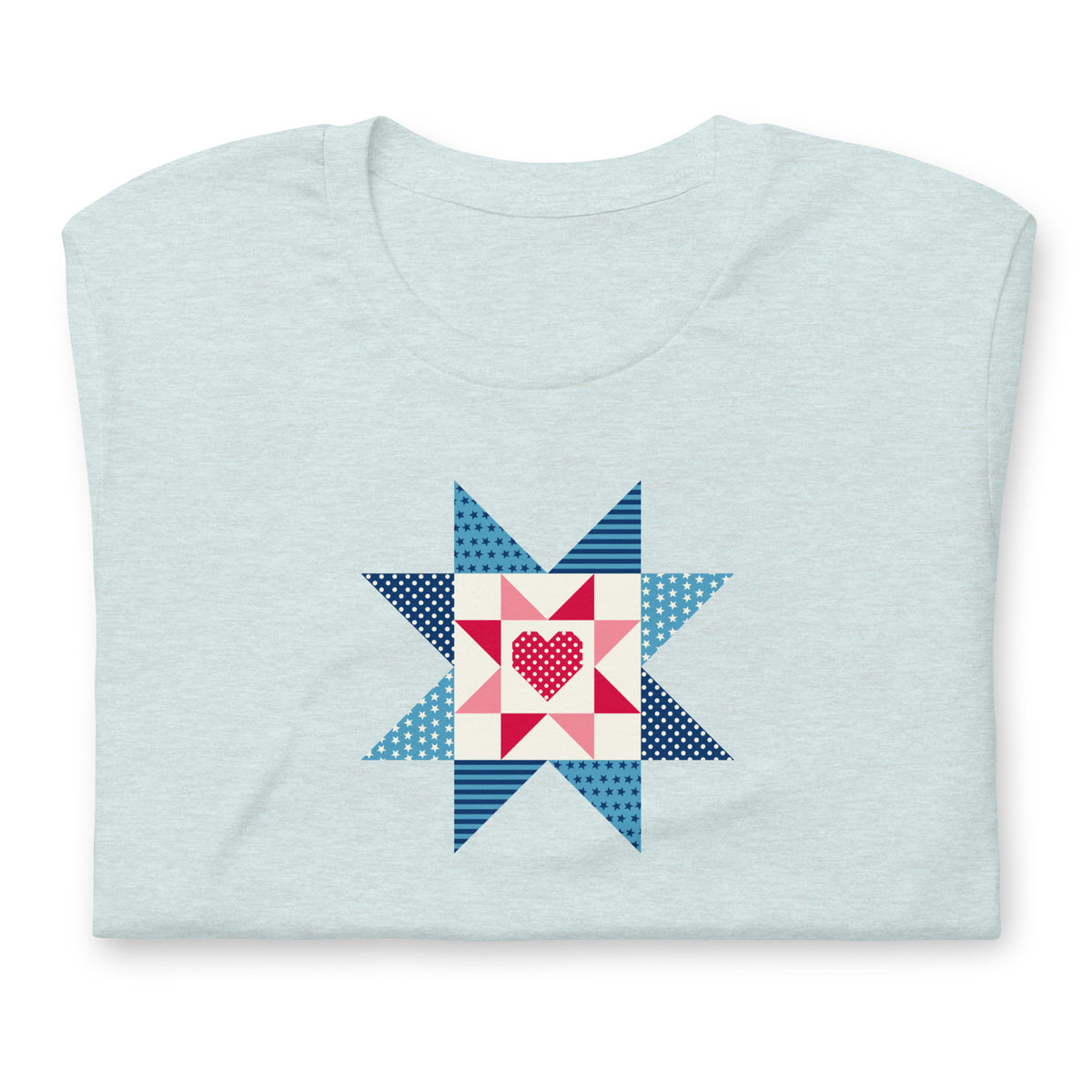 Liberty Love star quilt block with a heart in red, white and blue on a t-shirt in heather prism ice blue, folded close-up of the design – Kate Spain design for Pat Sloan