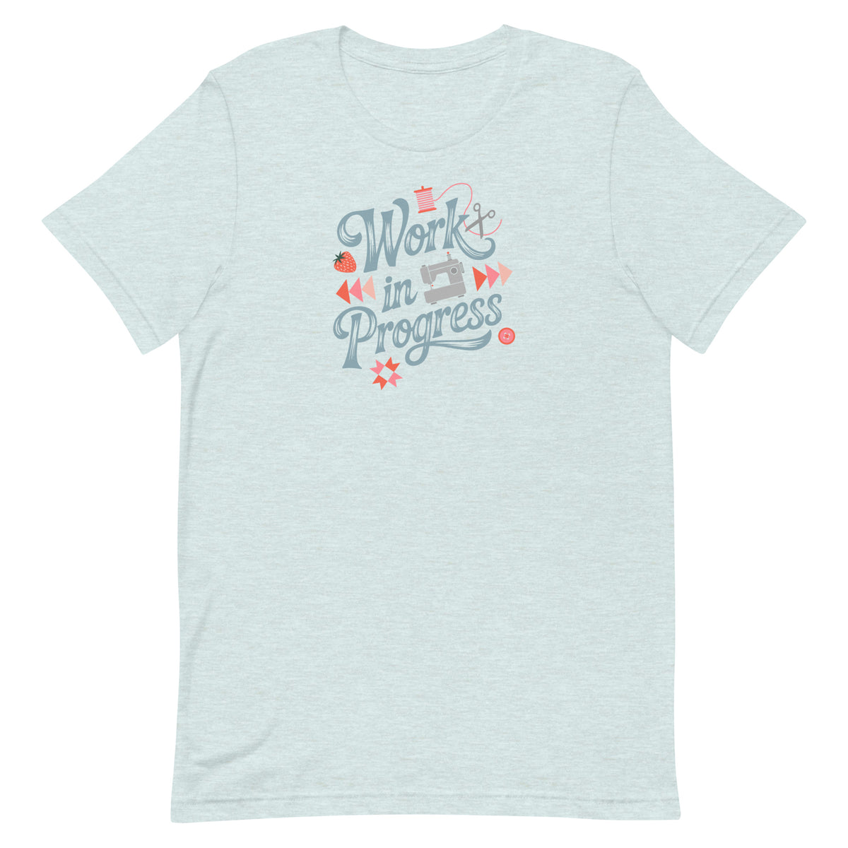 Work in Progress sewing design with flying geese, sewing machine, strawberry and thread spool on a t-shirt in heather prism ice blue, front view – Kate Spain design for Pat Sloan