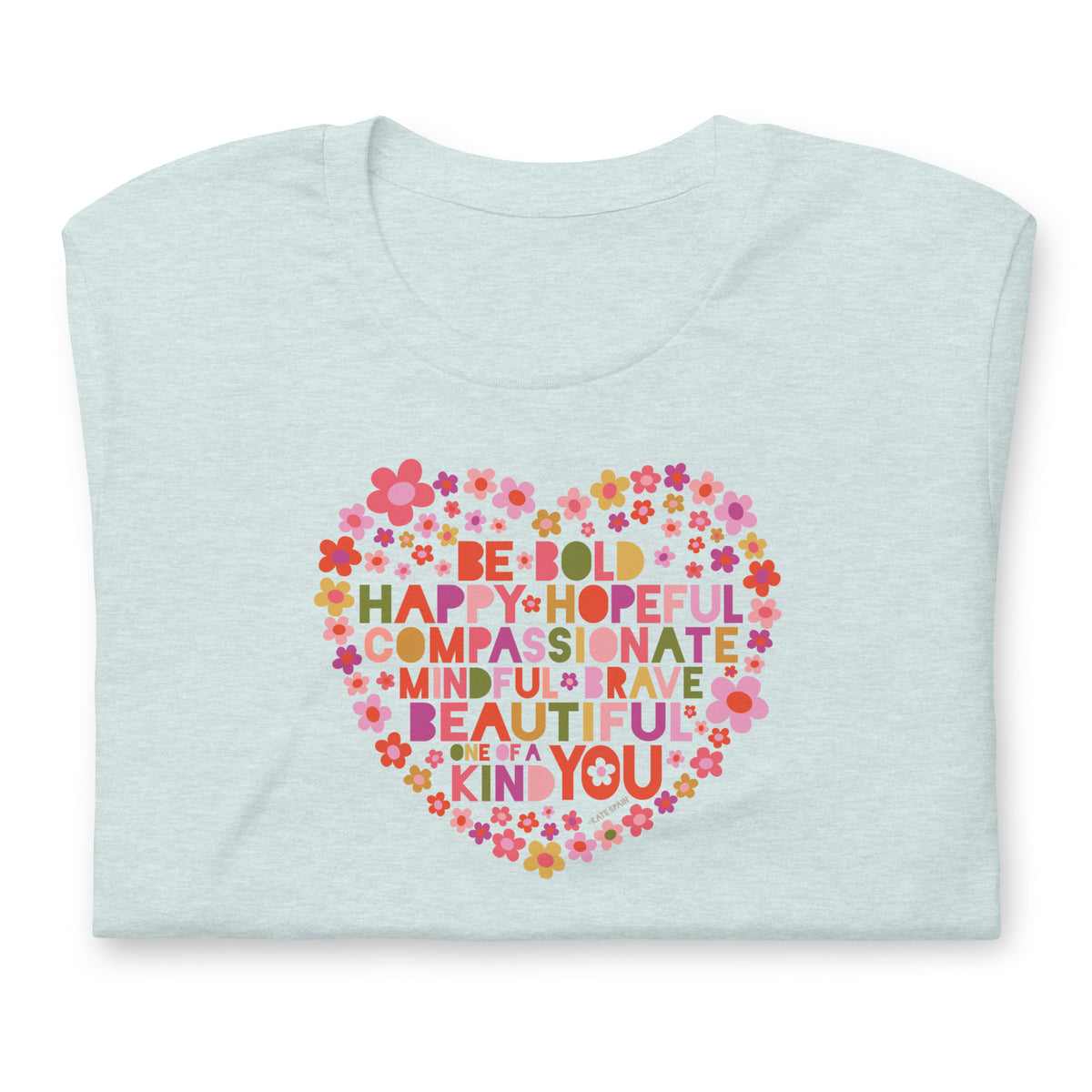 Be You floral heart of inspirational words on a staple t-shirt in heather prism ice blue, folded close-up of the design – Kate Spain design