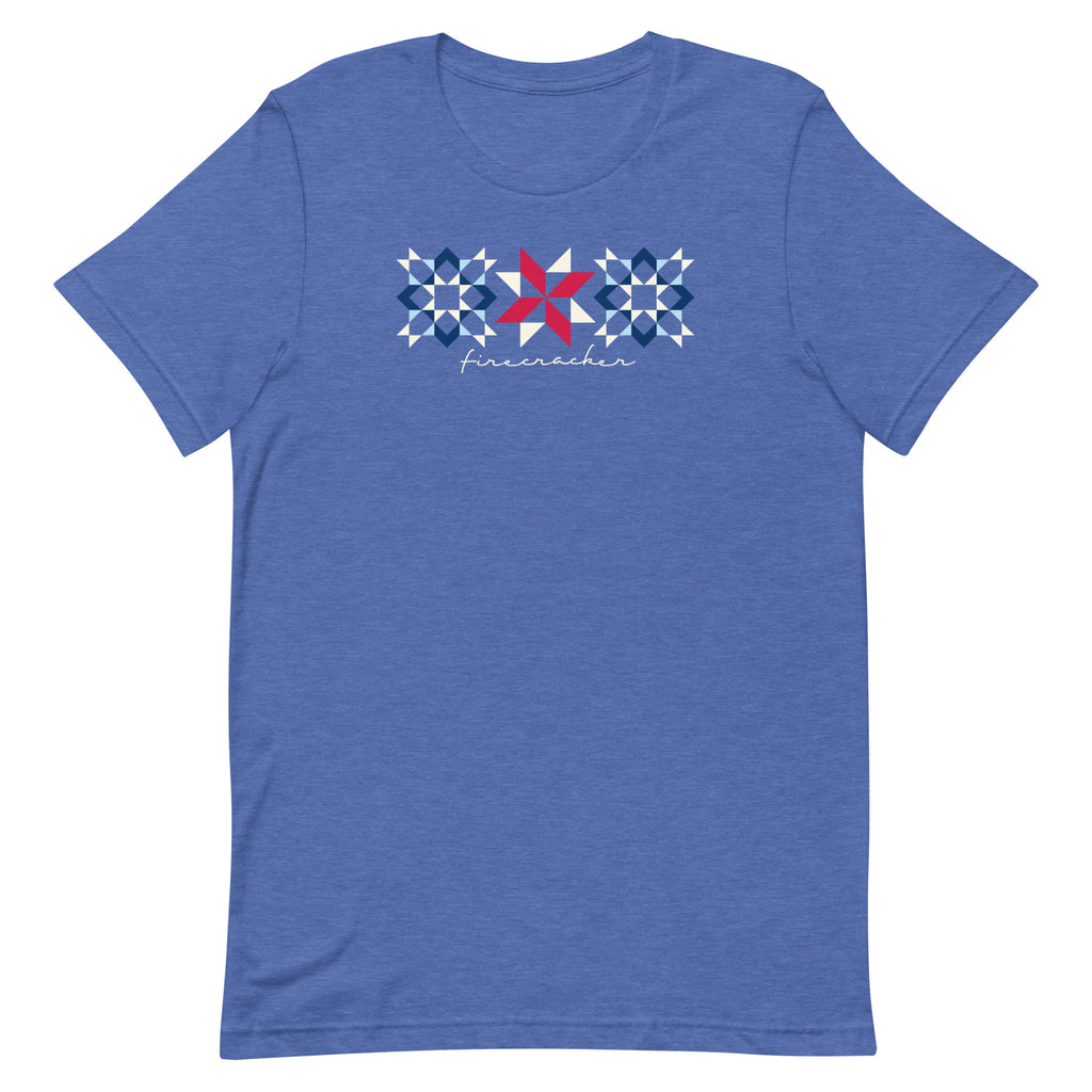 Firecracker quilt-block stars with script lettering in red, white and blue on a t-shirt in heather true royal, front view – Kate Spain design for Pat Sloan