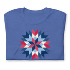 Barn Star quilt block in red, white and blue on a staple t-shirt in heather true royal blue, folded close-up of the design – Kate Spain design for Pat Sloan