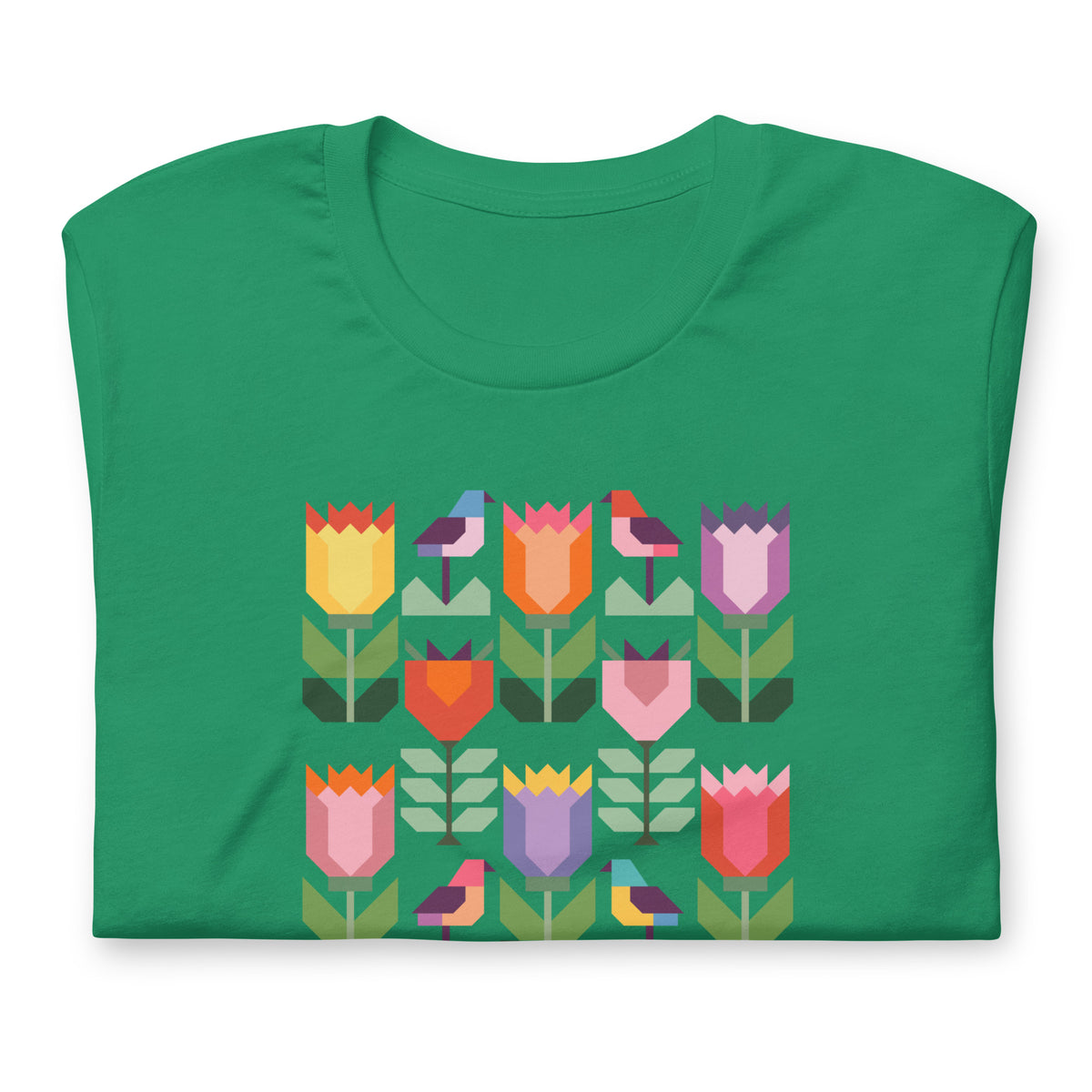 Birds + Blooms patchwork tulips and birds on a t-shirt in kelly green, folded close-up of the design – Kate Spain design for Pat Sloan