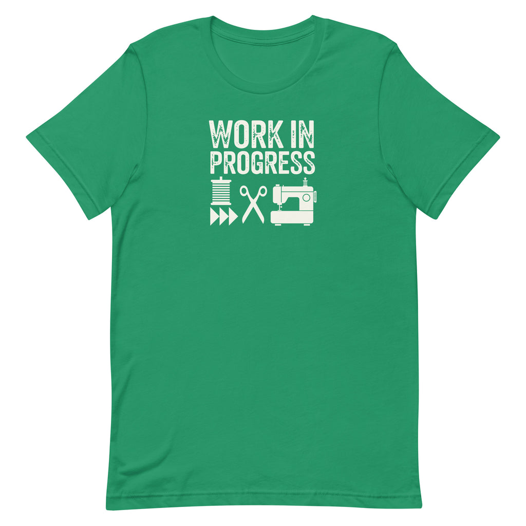 Work in Progress Mod distressed lettering with thread, scissors and sewing machine on a t-shirt in kelly green, front view – Kate Spain design for Pat Sloan