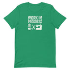 Work in Progress Mod distressed lettering with thread, scissors and sewing machine on a t-shirt in kelly green, front view – Kate Spain design for Pat Sloan