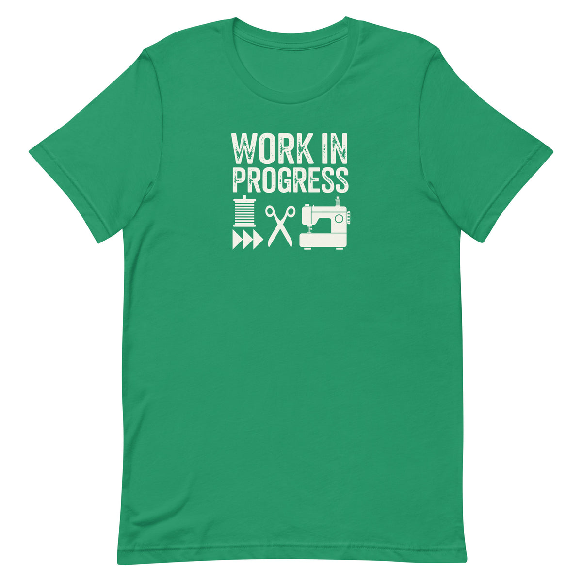 Work in Progress Mod distressed lettering with thread, scissors and sewing machine on a t-shirt in kelly green, front view – Kate Spain design for Pat Sloan