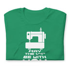 May the ¼" Be With You white sewing machine graphic on a staple t-shirt in kelly green, folded close-up of the design – Kate Spain design for Pat Sloan