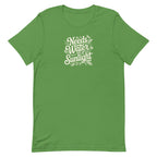 Needs Water + Sunlight hand lettering with leaf and sun accents on a t-shirt in leaf green, front view – Kate Spain design