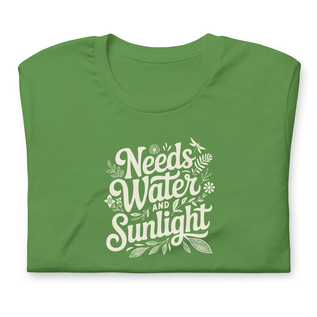 Needs Water + Sunlight hand lettering with leaf and sun accents on a t-shirt in leaf green, folded close-up of the design – Kate Spain design