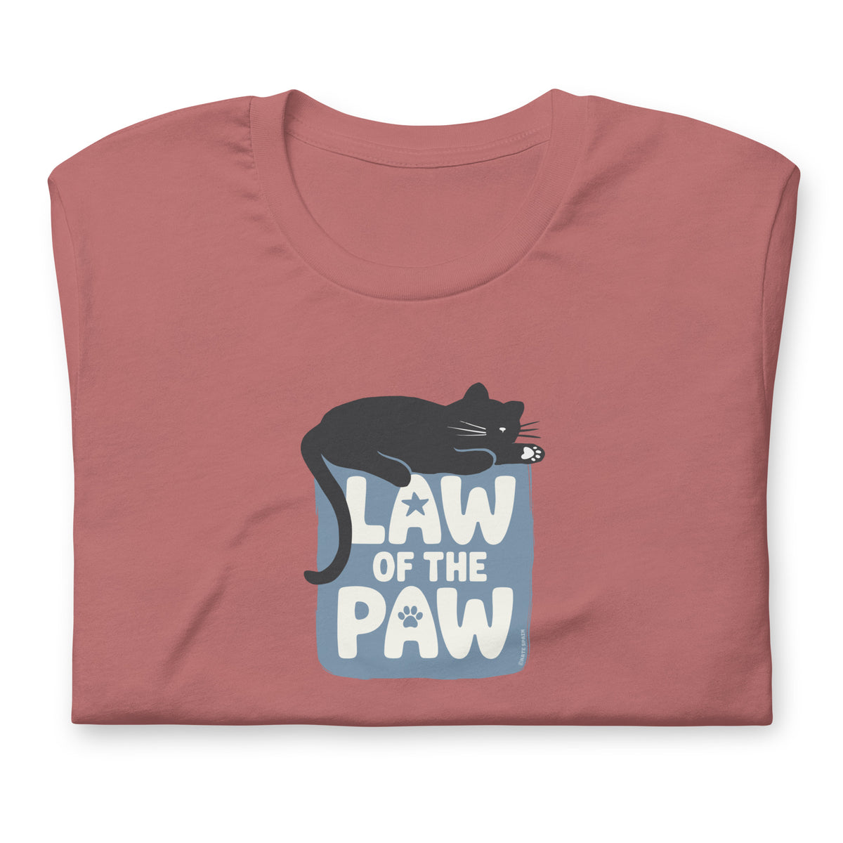 Law of the Paw® design with a cat napping on the logo on a t-shirt in mauve, folded close-up of the design – Kate Spain design