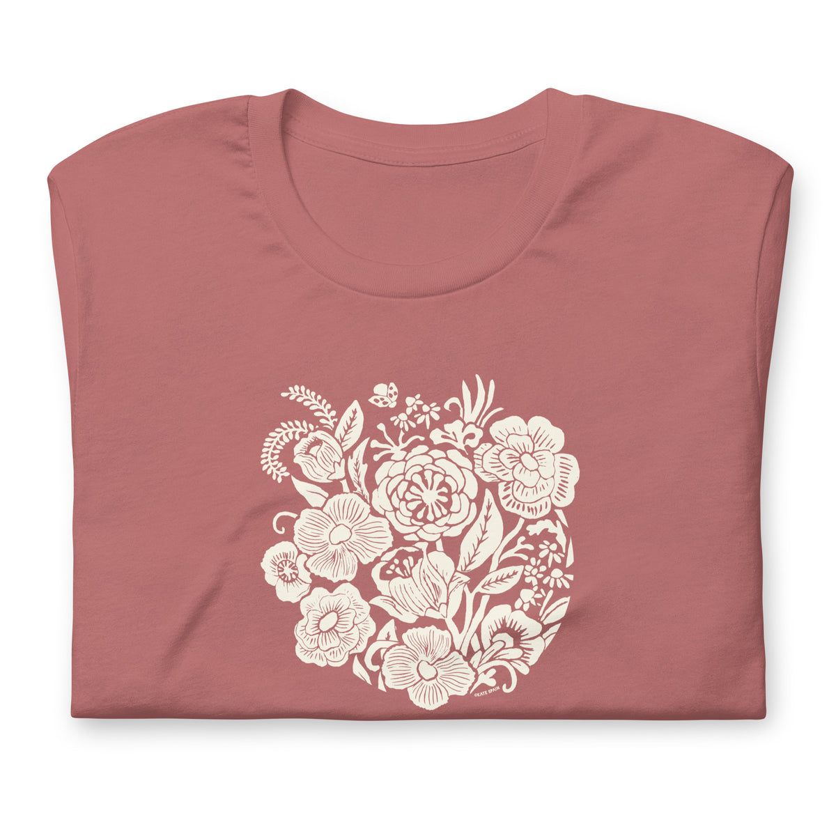Meadowsweet woodblock-style bouquet of wildflowers on a t-shirt in mauve, folded close-up of the design – Kate Spain design