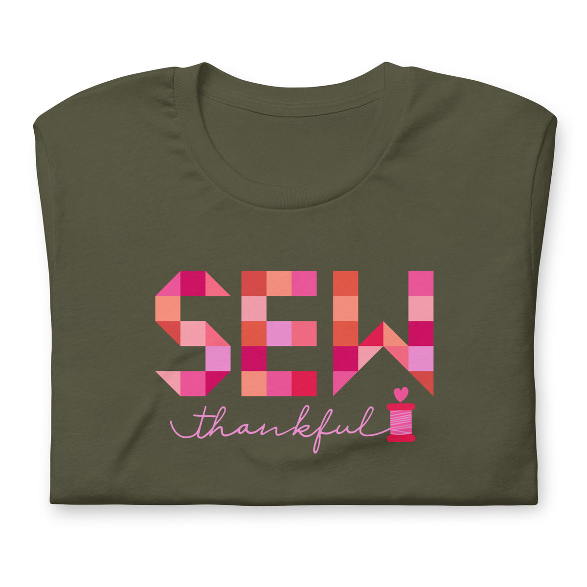 Sew Thankful patchwork lettering with a heart-topped thread spool on a t-shirt in military green, folded close-up of the design – Kate Spain design for Pat Sloan